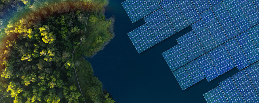 Solar panels installed on the water surface of a reservoir. The concept integrates green, clean energy technology with the natural ecosystem. Sustainable energy, environment, ESG, solar energy.
