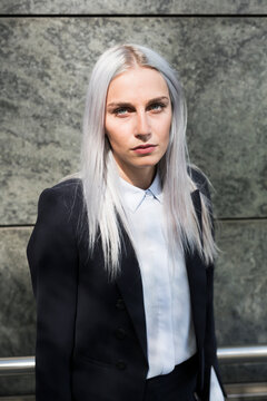 Portrait of serious young businesswoman outdoors
