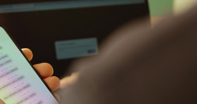 Modern stock footage showing a smartphone displaying an SMS security code for two-factor authentication, symbolizing digital security, account protection, online verification, and safe login processes