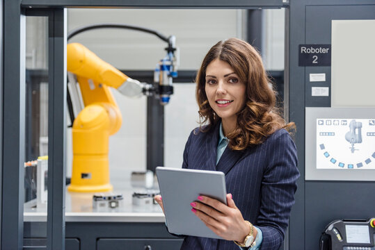 Businesswoman, working in high tech company, using digital tablet