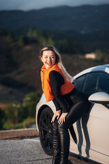 Young Woman With Sports Car at Sunset