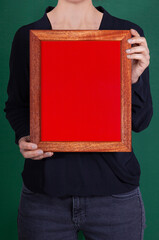 In the decorative background, a woman is holding a picture frame.