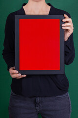 In the decorative background, a woman is holding a picture frame.