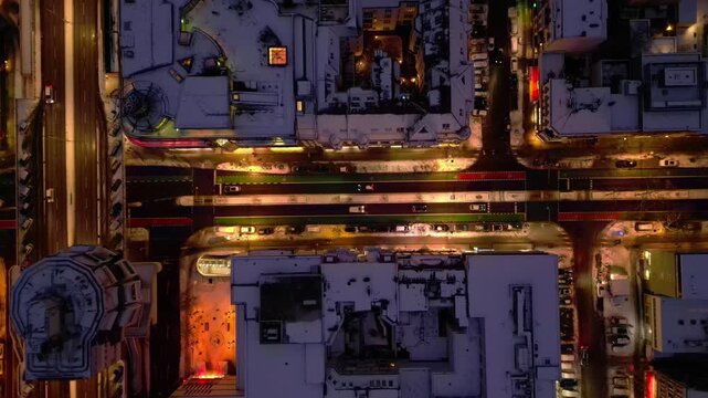 Berlin illuminating shopping street snowed at night. Amazing aerial view drone