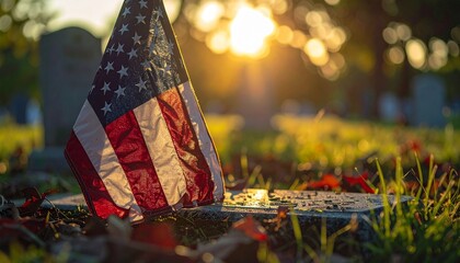 American flag at a gravesite during sunset on Memorial Day.
