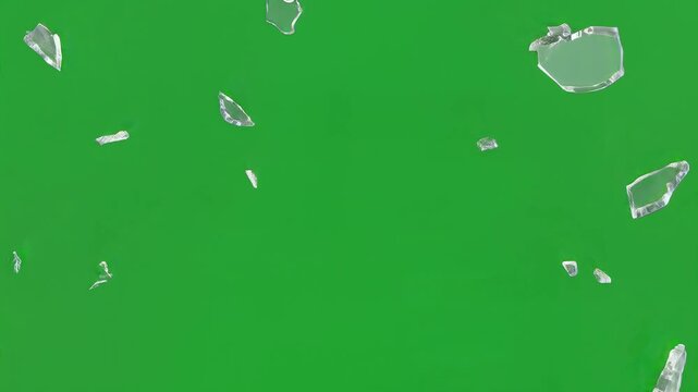 Sharp Glass Shards Explode and Scatter Against Vibrant Green Background