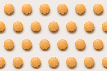 Seamless pattern of orange supplement tablets on a clean sterile background. Modern healthcare texture ideal for pharmaceutical design, wellness campaignsand medical marketing.