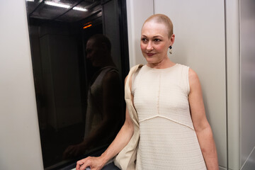 Bald woman smiling reflecting confidence and acceptance