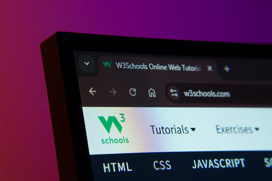 Dhaka, Bangladesh- 02 June 2025: Close-up of a computer screen displaying the W3Schools web interface in dark mode