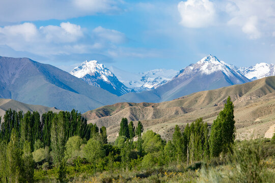 View of the Tian Shan Mountains in Kyrgyzstan with Boris Yeltsin Peak, or Oguz-Bashi in the center.
