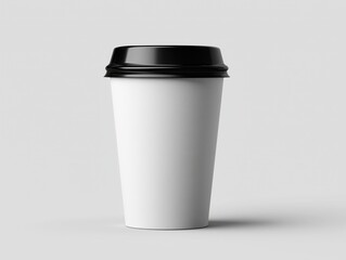 Naklejka premium Blank white coffee cup with black lid positioned on a light gray background, ideal for branding or design mockups and promotional materials