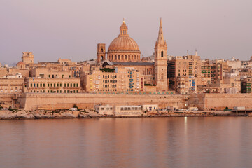 Malta Valletta Skyline with Basilica of our Lady of Mount Carmel Dome and St.Pauls Anglican Cathedral Spire,SunsetValletta, Malta,Europe