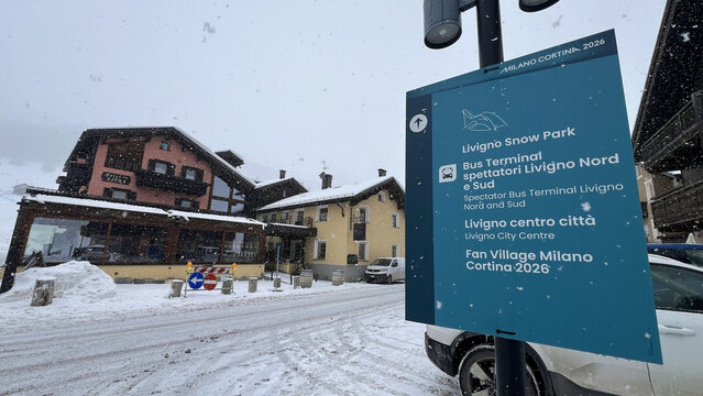 Livigno, Italy - February 4, 2026: Milano Cortina 2026 bus stop sign for Livigno Snow Park, Olympic Fan Village and city center in snowy Livigno, Italy