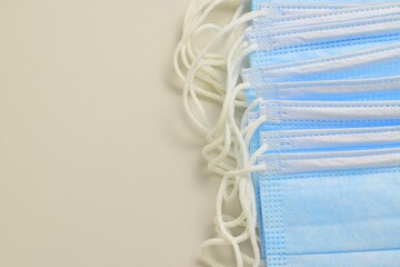 Medical masks covering the mouth and nose to protect against bacteria, on a white background