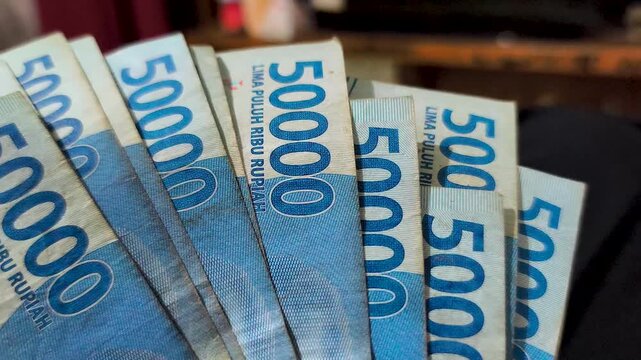 Close up of the fifty thousand rupiah figure on an Indonesian banknote