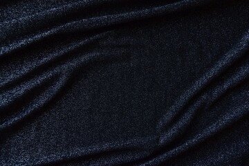 Fototapeta premium Black fabric texture. Shiny black lurex fabric with soft folds