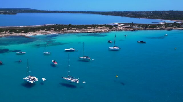 turquoise water coastline with salt flats and boats. Unique aerial view drone