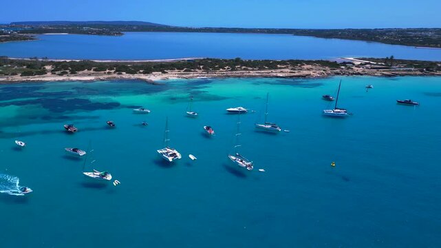turquoise water coastline with salt flats and boats. Lovely aerial view drone