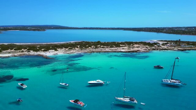 turquoise water coastline with salt flats and boats. Nice aerial view drone