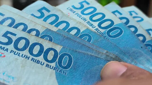 Close up of the fifty thousand rupiah figure on an Indonesian banknote