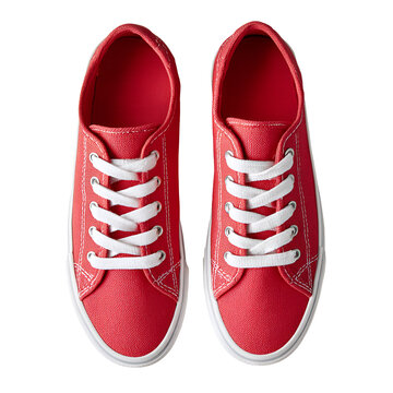 Pair of red sneakers with white laces on a white background