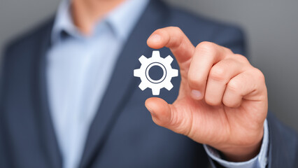 businessman holding gears on fingers, showing the concept of business process management or technology integration