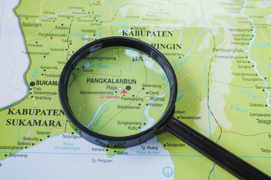 Close up of Iskandar airport at Pangkalanbun district, map pinned using magnifying glass, Air transportation access to orang utan conservation at tanjung puting park