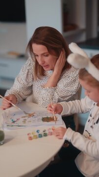 Mother and Daughter Enjoy Creative Painting Together, Celebrating Easter with Bunny Ears