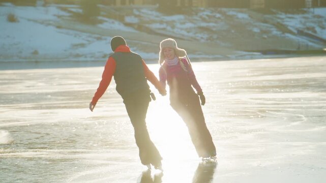 A Joyful Day on Ice: A Couple Skating Together in the Glimmering Sunlight While Embracing the Beauty of Winter's Chill and the Fun of Ice Skating on a Frozen Lake Amidst a Picturesque Scenery