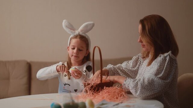 Happy Family Decorates Easter Eggs and Prepares for Celebration at Home