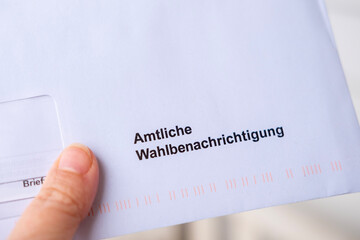 Close-up white envelope with German text Amtliche Wahlbenachrichtigung, official voter notification...