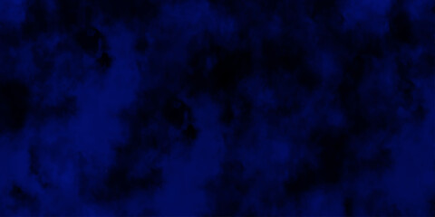 Artificial magic smoke in black and blue light on black background in darkness. light blue and dark blue background. Black and blue Grunge Concrete Wall Texture Background.