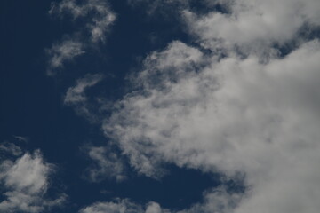 Obraz premium The background is a clear sky accompanied by white clouds