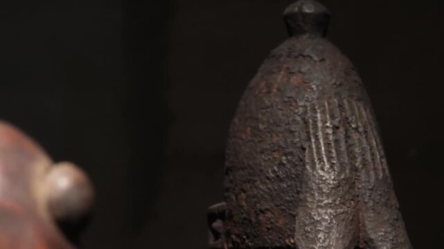 An exhibition showcasing Central African art: ritual masks, wooden sculptures, busts, and figurines representing the cultural heritage and ethnic style of the continent.