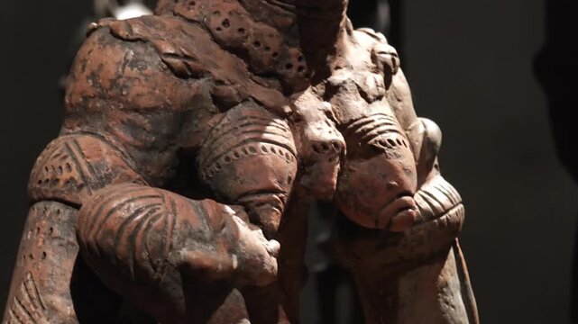 An exhibition showcasing Central African art: ritual masks, wooden sculptures, busts, and figurines representing the cultural heritage and ethnic style of the continent.