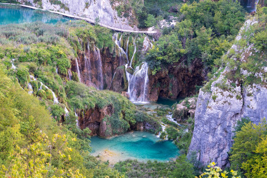 Plitvice Lakes, Croatia - August 16, 2025: Scenic landscape of turquoise lakes and waterfalls in National Park.