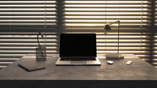 Laptop computer on a desk with lamp and office supplies in a room