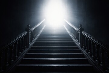 Fototapeta premium dark staircase leads up to a bright light at the top, symbolizing hope and ascension.