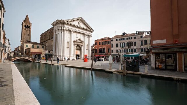 Venice canal hyperlapse with museum, ancient square and tourists on an overcast day