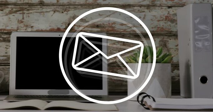 White circle appearing over desk, changing icon to mail, rotating, revealing laptop, signaling mail