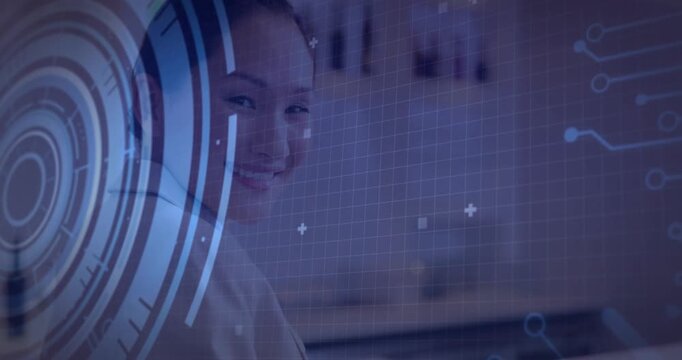Female pro turning toward camera in office, HUD activating, code overlay framing face to show tech