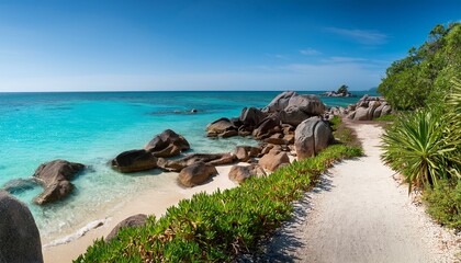 Scenic Coastal Pathway With Rocks And Sandy Beach Seaside Shoreline With Vegetation And Turquoise Water