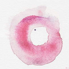 Abstract pink watercolor circle frame. Round rose paint wash ring on white paper.