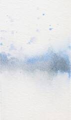 Abstract blue watercolor background with splashes. Vertical winter snow mist paint wash on textured paper.