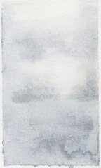 Abstract gray watercolor texture background. Vertical hand painted blue grey wash on white paper.