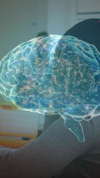 Vertical video: Medical doc raising hands causing AR brain over forearm patch, mapping neural paths