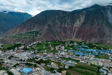 Tibetan Mountain Village in Alpine Valley with Traditional Architecture