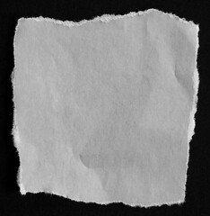 Torn paper on black