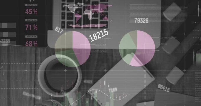 Animation of statistical data processing and changing numbers over office equipment on wooden table