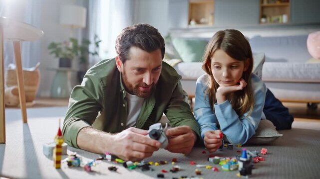 Child father playing floor cozy living room closeup. Happy dad talking girl